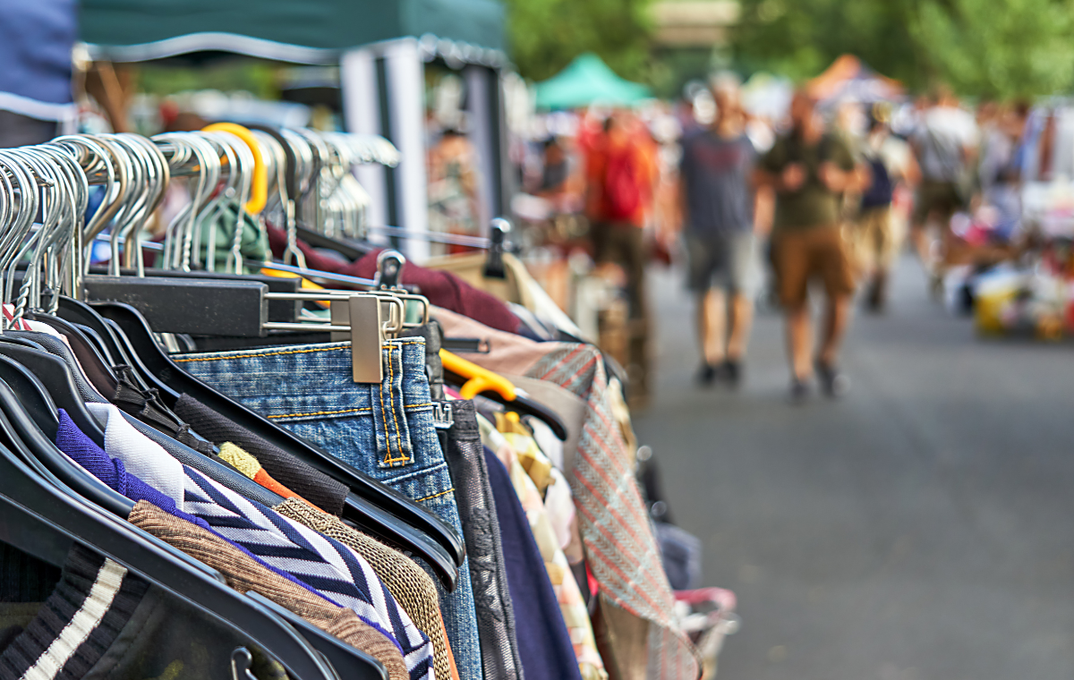 Racks of clothing and vintage finds along the market street